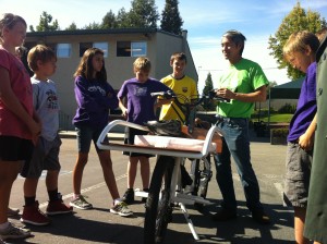 Neal Saiki showing students his NTS Works Cargo Bike